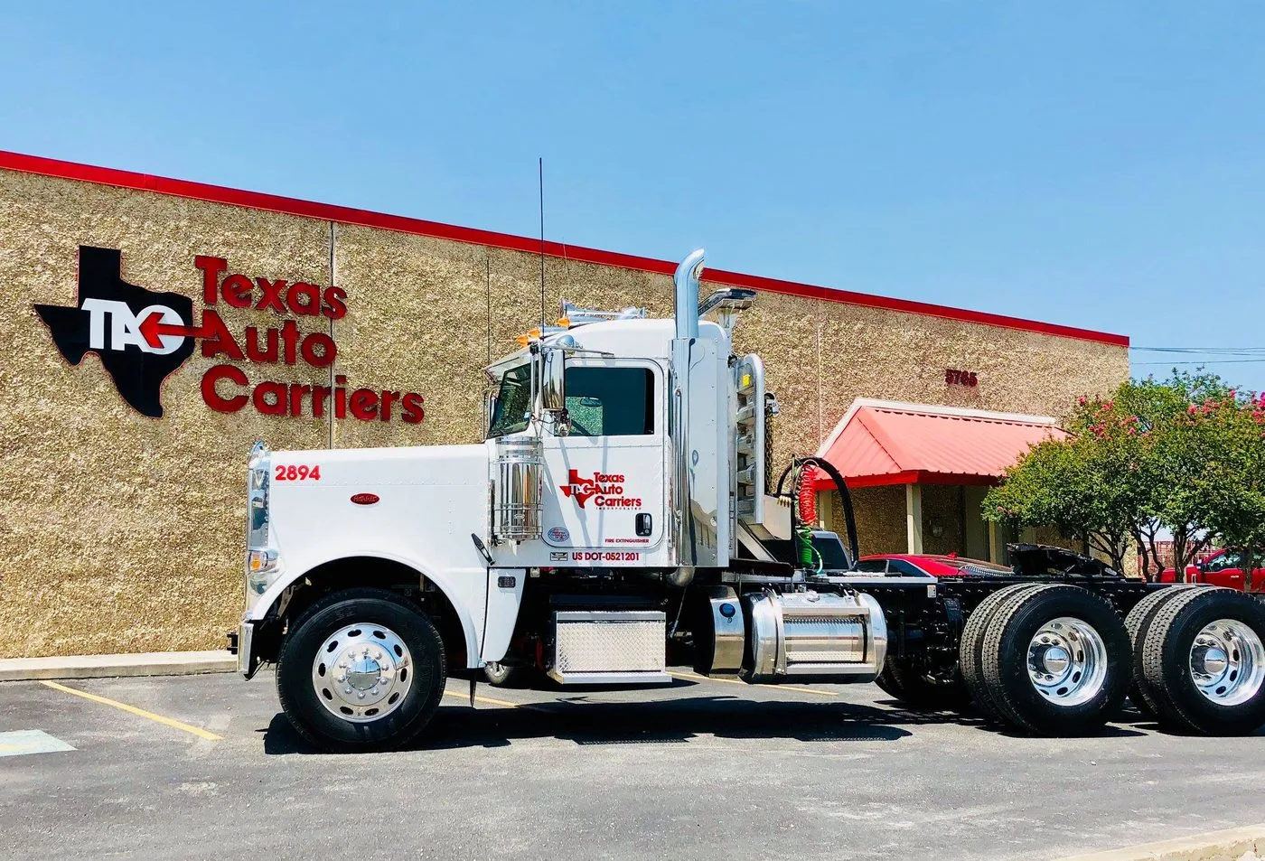 Texas Auto Carriers Peterbilt tow truck parked outside the Texas Auto Carriers facility in San Antonio, Texas